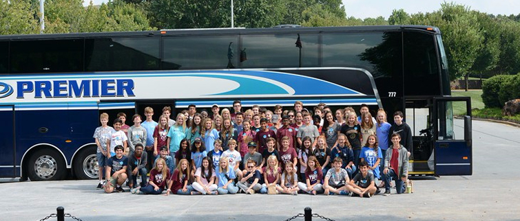 Middle school students boarding bus